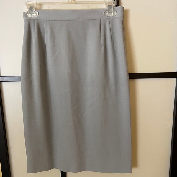 Vintage  Giorgio Armani Skirt, size 6. Knee length, light grey, natural waist, back zip, kick pleat. Fully lined and perfect for Spring.
