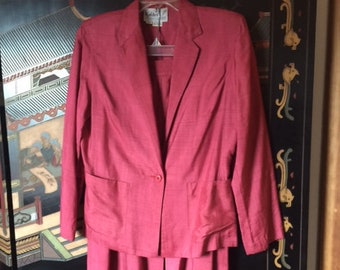 Vintage Silk Suit with 1970's styling, high-waisted, front slit skirt, jacket with patch pockets, beautiful, deep rose color. Size 9-10.