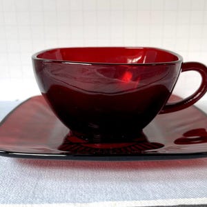 Vintage Charm Cup & Saucer Set. Royal Ruby Glass from the 1950s. Fire-King by Hocking. Distinctive square shape. Perfect..