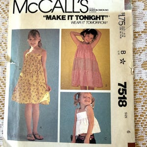 May include: A McCall's sewing pattern envelope for number 7518, size 6. The front features three images of children wearing a tiered yellow floral dress, a red and white gingham tiered dress, and a white sleeveless top with a scalloped hem.