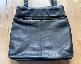 Black Leather Shoulder Bag by Nine West with zipper pockets inside and out. Top snap closure, double straps. 11" x 12". Vintage & Beautiful.