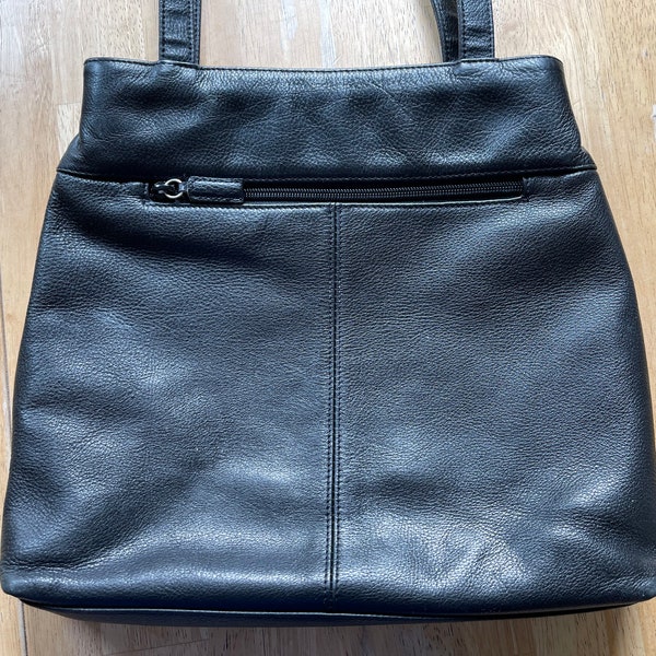 Black Leather Shoulder Bag by Nine West with zipper pockets inside and out. Top snap closure, double straps. 11" x 12". Vintage & Beautiful.