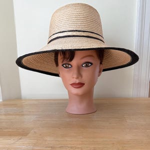 Italian Straw Hat. Size 22&quot;. Pretty big brimmed natural straw hat with straw hatband, straw bow in back. Black color accent around brim.