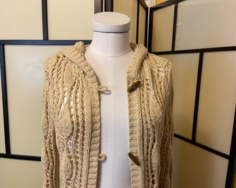 Vintage Hooded Cardigan. Beige or tan, hand made, open knit with lovely pattern. A long sweater that has ribbing at bottom, cuffs and hood.