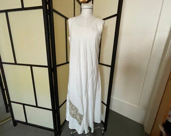 Vintage White Linen Dress, Sleeveless, long with flared skirt that is cut on the bias so the hem falls in pleats and points, Size Large.