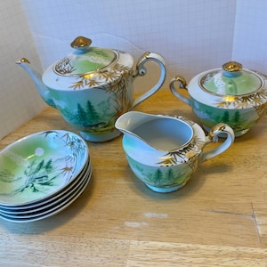 Vintage Tea Set. Pretty Japanese mountain village with tall evergreens. Gold bamboo accents typical of mid century Kutani porcelain.