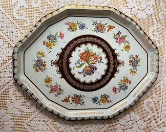 Vintage Daher Tray made in England. Large, oval, metal with 12 sides, white background and colorful floral pattern. Dates to 1970s.