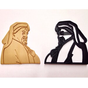 May include: A set of three ceramic nesting bowls in graduating sizes. The bowls are white with a blue floral pattern and a scalloped edge. The largest bowl is approximately 8 inches in diameter.