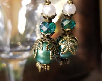 Green glass and pearl Victorian inspired earrings with antique bronze accents.