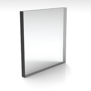 May include: A clear, rectangular acrylic block with a dark gray border. The transparent center reflects light, creating a bright, minimalist aesthetic. The block is standing upright, casting a subtle shadow.