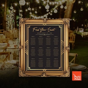 May include: A gold-framed seating chart with the text "Find Your Seat" in elegant script. The chart features a black background with gold Art Deco-style accents and guest names listed under table numbers. The wedding reception is set outdoors.