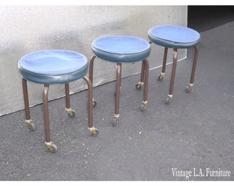 Three Vintage Mid Century Modern Industrial Blue Stools on Castors