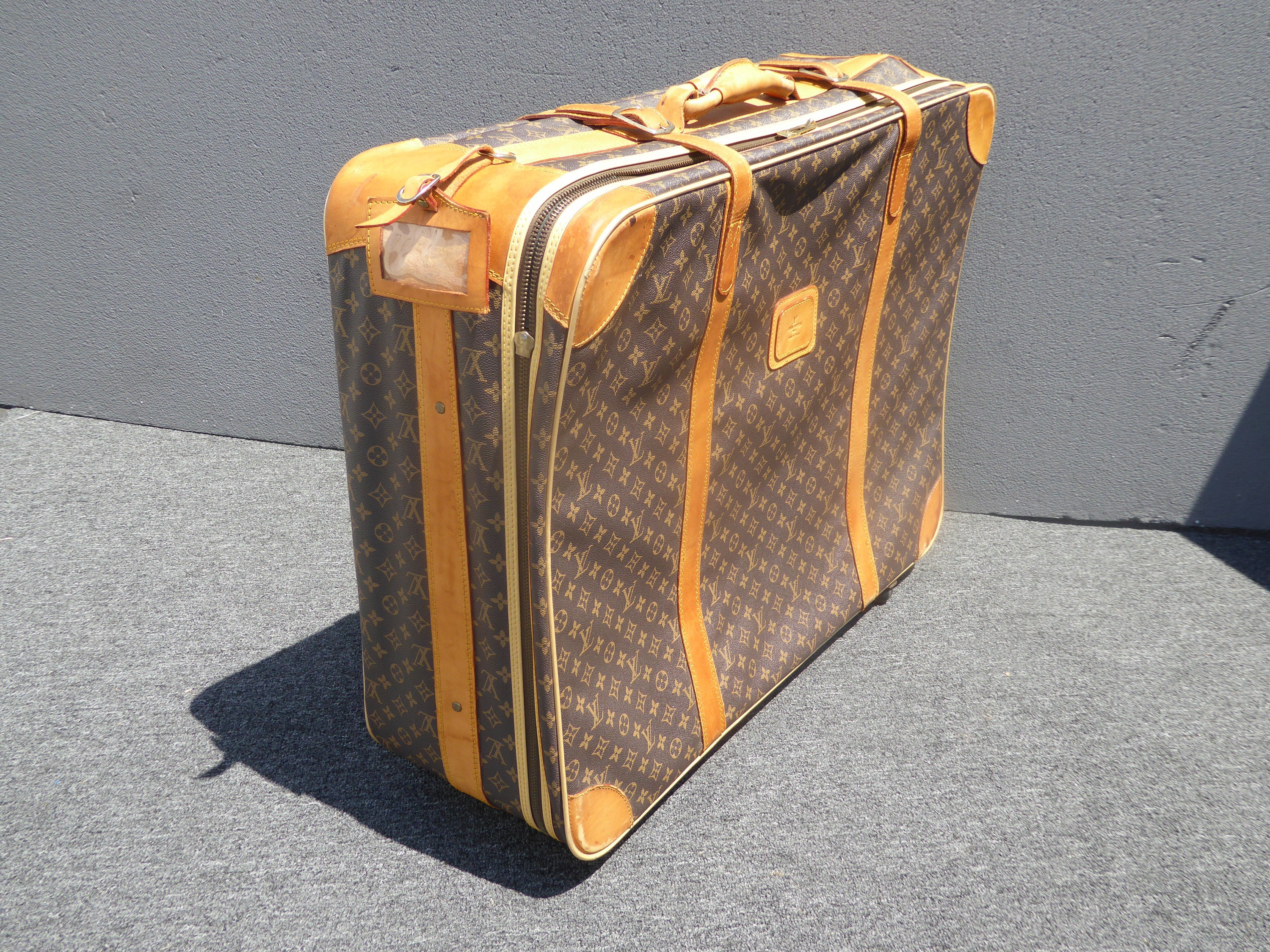 Louis Vuitton Rolling Luggage Coveralls | IQS Executive