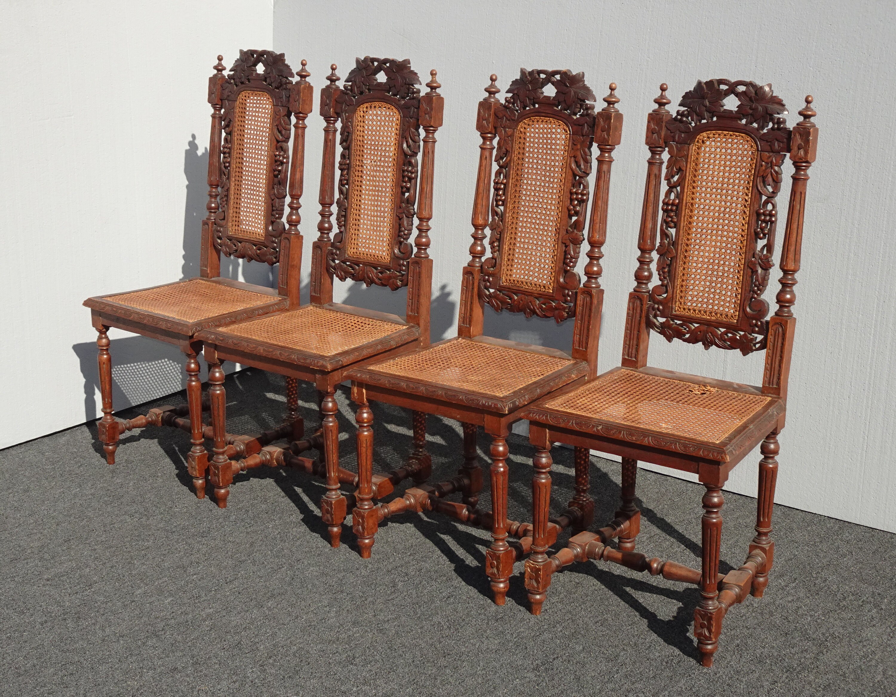 Set of Four Vintage Spanish Revival Ornate Carved Cane Dining Accent