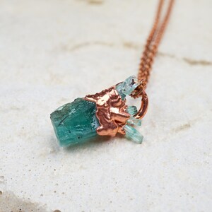 Raw emerald necklace. Dainty rough gemstone pendant with copper chain. Natural May birthstone jewelry. Rustic green uncut crystal gems
