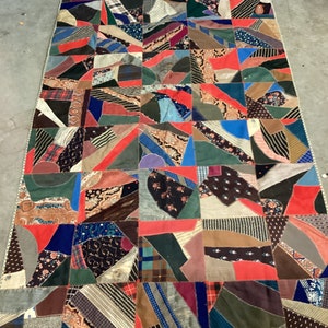 Wow look at the date on this very old crazy quilt 1889