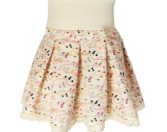 Pleated skirt white with colorful flowers for girls size 80-164 made from organic cotton