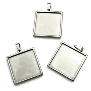 May include: Three silver square pendant trays with a smooth, shiny finish. The trays are designed to hold a variety of materials, such as resin, glass, or metal.