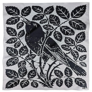 May include: A black and white illustration of a bird perched on a branch with leaves. The bird is facing to the right and has a long tail. The leaves are detailed and have a textured look.