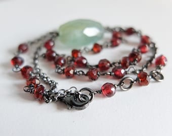 Asymmetrical Garnet and Aquamarine necklace in oxidized silver