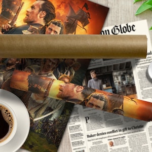 May include: A rolled up poster depicting a group of people in a pirate-themed scene. The poster is on a wooden table with a cup of coffee and a newspaper.