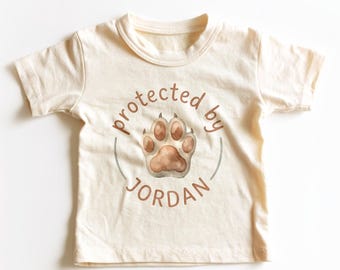 Personalized Protected By Dog Kids Shirt - Custom Dog Paw Toddler Tee