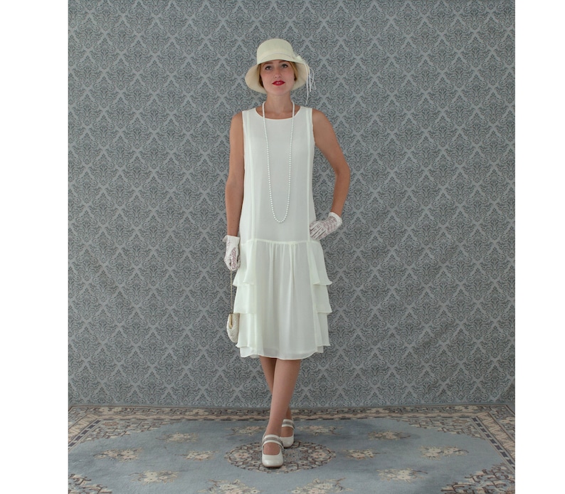 White Flapper Dresses, White 1920s Dresses     A darling 1920s-inspired dress in cream with tiered skirt Roaring 20s fashion Great Gatsby dress 1920s flapper dress Downton Abbey dress  AT vintagedancer.com