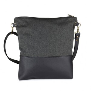 charcoal black medium-sized crossbody bag with hand-smocked pleated detail and  black vegan leather bottom and adjustable strap; back view (without smocked detail)