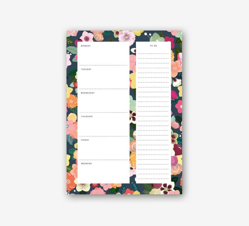 May include: A floral-patterned notepad with a dark blue background. The notepad features a weekly schedule on the left and a to-do list on the right. The floral design includes pink, yellow, and orange flowers.