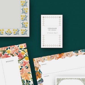 May include: Stationery items with floral designs. Includes notecards with the text "EMADAM ART & DESIGN" and "25 Notecards, 300g/m²". Other items have floral borders and the words "WEEKEND", "MONDAY", and "TUESDAY".