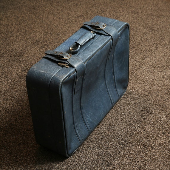 Vintage blue suitcase, vintage luggage, retro suit