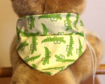 Dog over-the- collar style bandanas with cute Alligator prints on off-white and black backgrounds