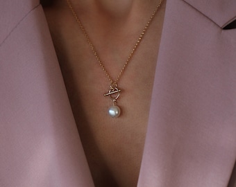 Odis Necklace in Gold: A Unique Layering Necklace made in Vancouver with 14 Karat Gold Fill and a White Fresh Water Pearl Charm