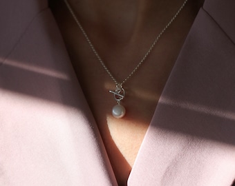 Odis Necklace in Silver: A Unique Layering Necklace made in Vancouver with Sterling Silver and a White Fresh Water Pearl Charm