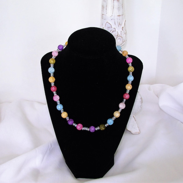 Multi color beaded necklace.  Bright and soft colors of raspberry, blue, yellow, pink, ivory, and green.  Colorful necklace in lotsof colors