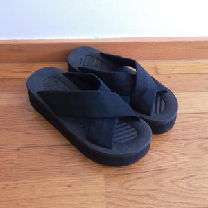Criss cross platform chunky black sandals.