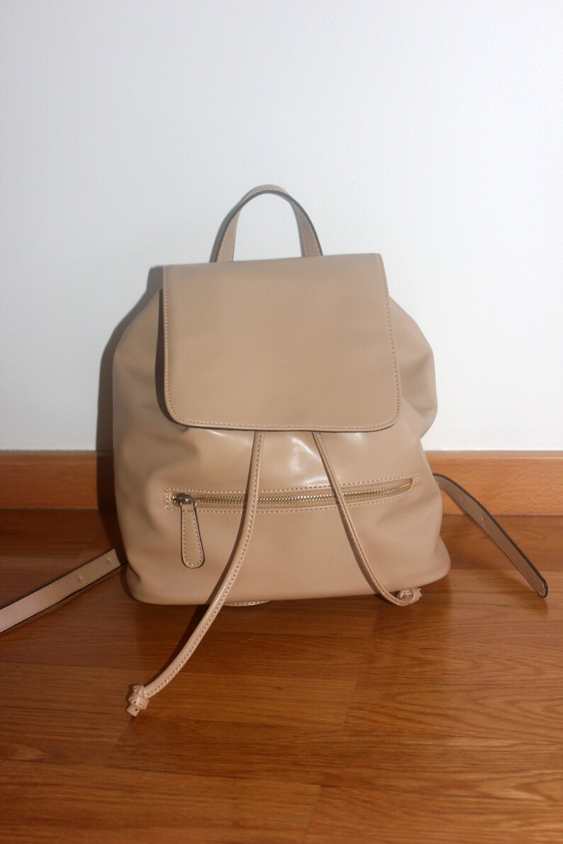 beige backpack leather