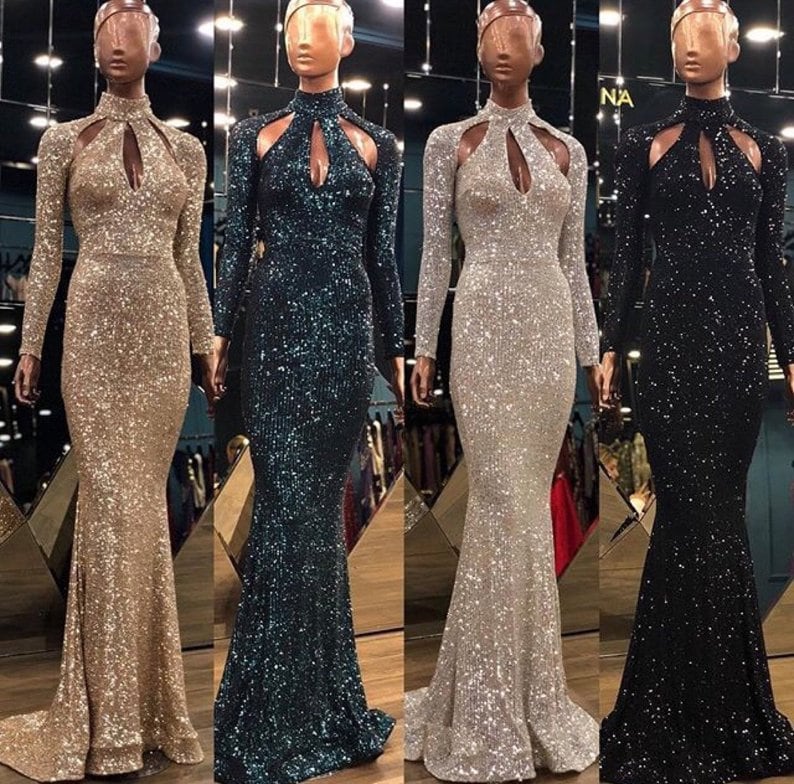 May include: Four long-sleeved sequined dresses in gold, teal, silver, and black. Each dress has a high neckline with a keyhole cutout and a fitted silhouette.