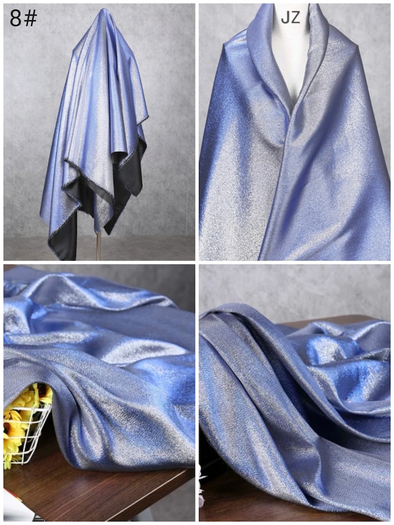 May include: A close-up of a silver fabric with a subtle shimmer. The fabric is draped over a mannequin and a table. The fabric is light blue in color.