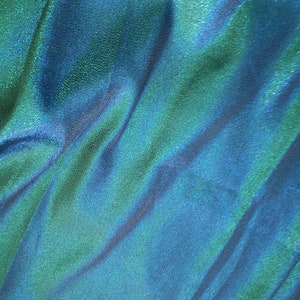 Tela iridiscente verde azulada brillante, tela holográfica para vestuario escénico, tela para vestido de fiesta de graduación, tela jacquard para decoración del hogar y cojines de sofá