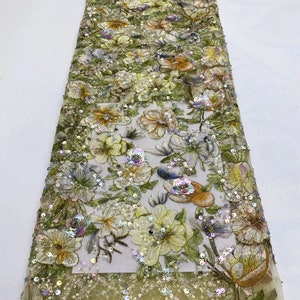 May include: A yellow floral embroidered lace fabric with iridescent sequins. The fabric has a delicate mesh base and features a variety of floral designs with sequins and beads.
