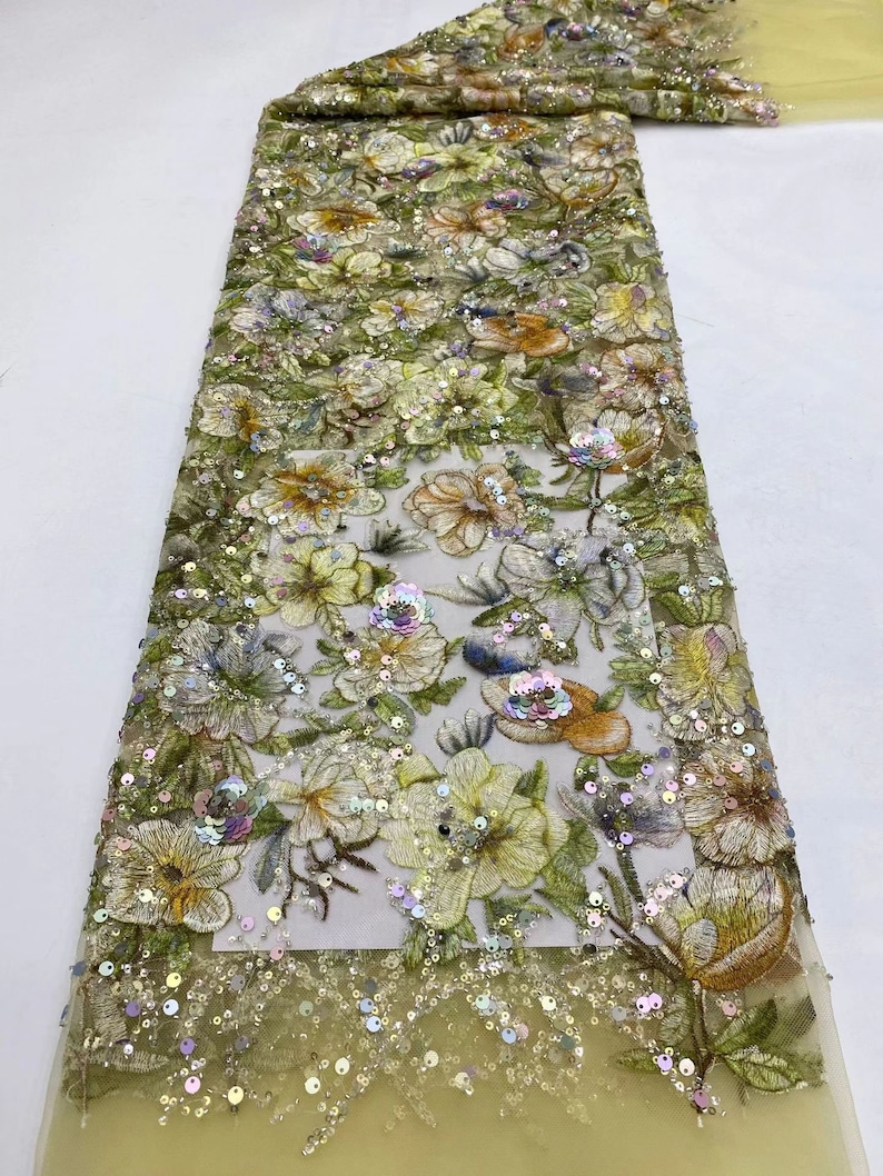 May include: A yellow floral embroidered lace fabric with iridescent sequins. The fabric has a delicate mesh base and features a variety of floral designs with sequins and beads.