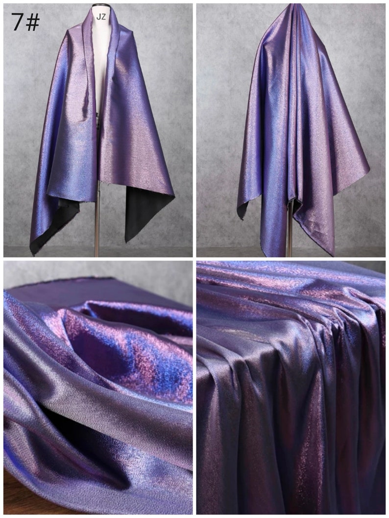 May include: A close-up of iridescent purple fabric with a subtle shimmer. The fabric is draped and folded to show its texture and sheen.