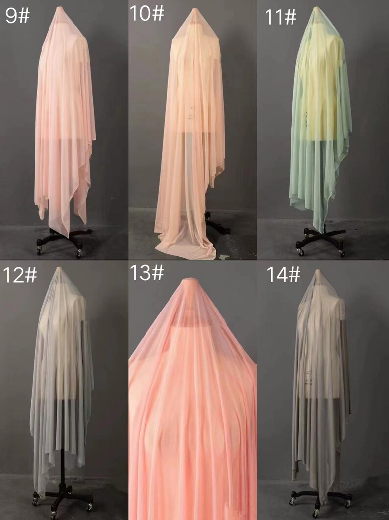 May include: Six different colors of sheer fabric draped over a dress form. The fabric is a lightweight, gauzy material that is perfect for making curtains, scarves, or other lightweight garments. The colors are peach, light pink, light green, gray, and a darker shade of pink.