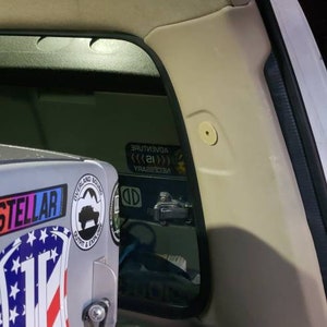 Covers for seatbelt mount holes in gray ot tan