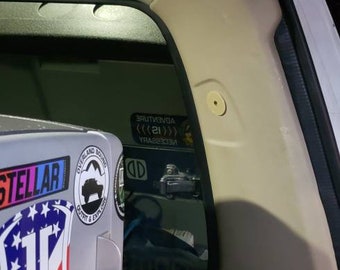 Covers for seatbelt mount holes in gray ot tan