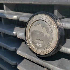 Badge grill mount