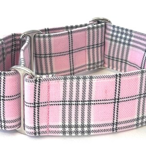 May include: A pink and gray plaid dog collar with silver hardware.