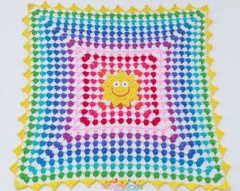 May include: A rainbow crochet baby blanket with a yellow crocheted sun in the center. The blanket has a scalloped border.