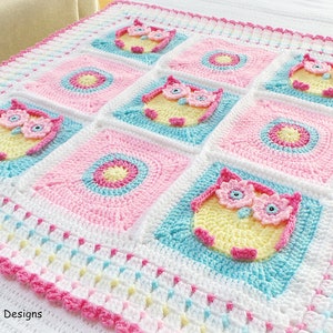 May include: A crocheted baby blanket with a pink, white, and blue color scheme. The blanket features a repeating pattern of owls and circles. The blanket is edged with a pink crocheted border. "Kerry Jayne Designs" is written in the bottom left corner.